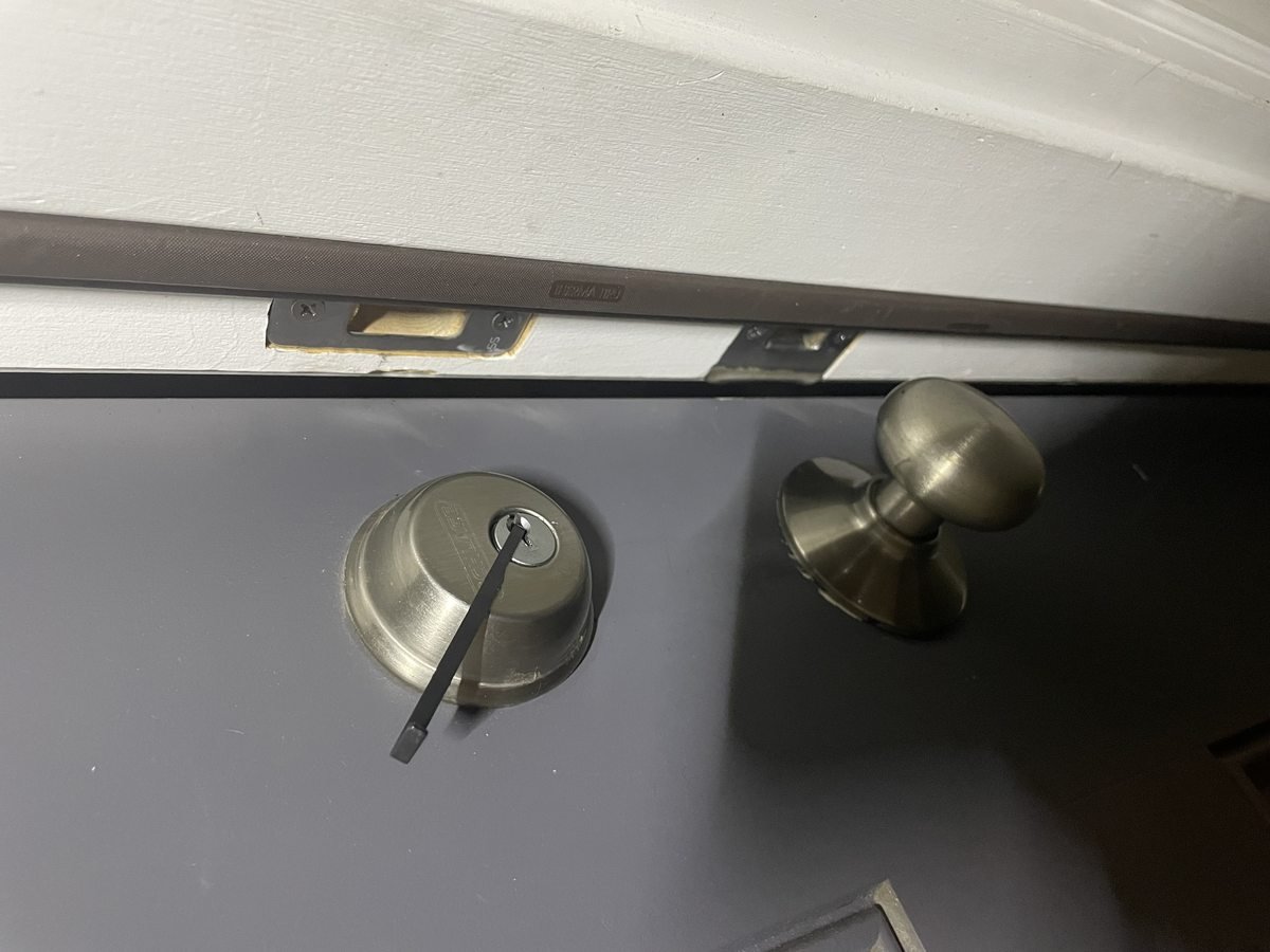 Locksmith Powell Ohio opening a residential deadbolt lock using professional pick tools — non-destructive lockout entry in Powell Ohio