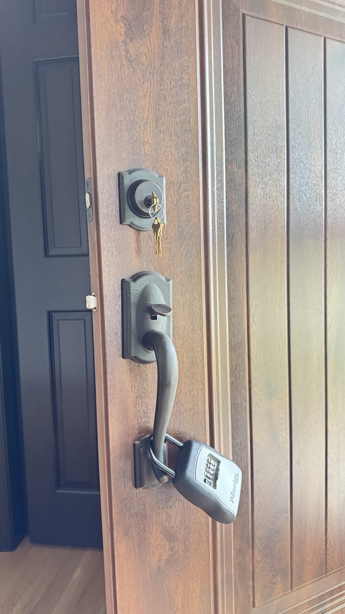 Locksmith Powell Ohio rekeying a residential front door deadbolt after move-in in Powell Ohio