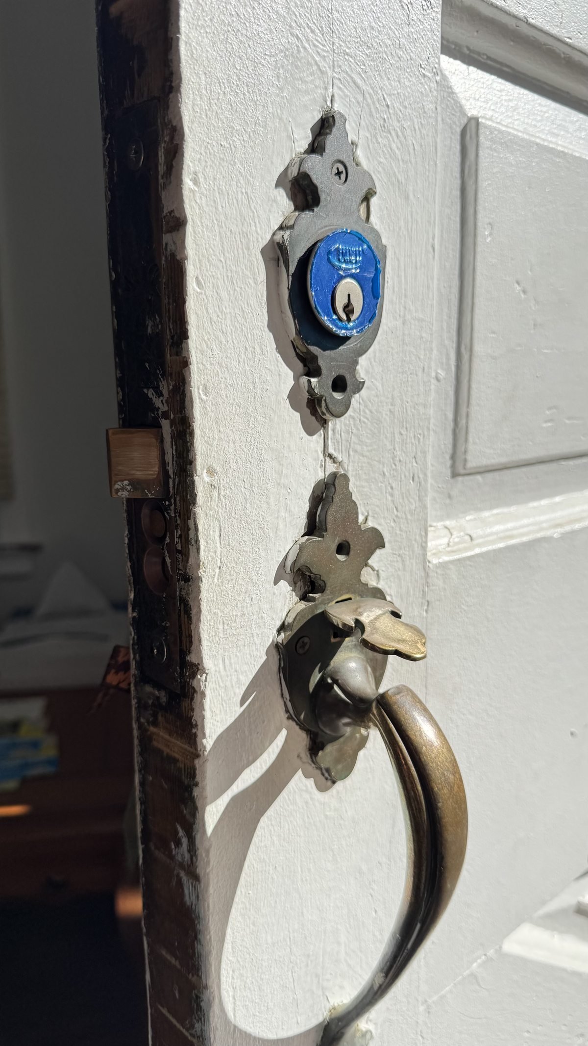Residential door lock replacement in Powell Ohio — old damaged lock being replaced by Locksmith Powell Ohio